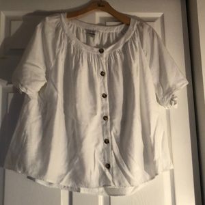Yoke neckline top with tied sleeves